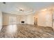 Bright living room with trey ceilings, fireplace, hardwood floors, and access to the patio at 2985 Pilgrim Mill Rd, Cumming, GA 30041