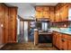 Updated kitchen area with stainless steel range, wood cabinets and granite countertops at 4292 Pinetree Dr, Powder Springs, GA 30127