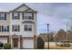 Inviting townhouse featuring a two-car garage and charming architectural details at 6798 Blackstone Pl # 12, Mableton, GA 30126