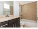 Well-lit bathroom features large vanity and tiled shower over tub at 1199 Huff Nw Rd # 109, Atlanta, GA 30318