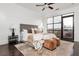 Bright and airy bedroom with a modern decor, large windows, and dark wood floors at 1199 Huff Nw Rd # 109, Atlanta, GA 30318