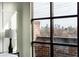 Bedroom boasts expansive window offering breathtaking city views at 1199 Huff Nw Rd # 109, Atlanta, GA 30318