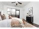 Stylishly decorated bedroom with a large bed, modern furniture, and lots of natural light at 1199 Huff Nw Rd # 109, Atlanta, GA 30318