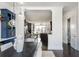 View of dining area connecting to modern kitchen and featuring a large dark wood dining table at 1199 Huff Nw Rd # 109, Atlanta, GA 30318