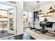 Elegant dining space with navy cabinets, modern lighting, and a balcony access at 1199 Huff Nw Rd # 109, Atlanta, GA 30318