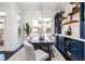 Dining room with modern furniture, custom cabinets with wine storage, and a view of the outside at 1199 Huff Nw Rd # 109, Atlanta, GA 30318