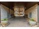Covered brick paved driveway leading to parking area with large potted plants at 1199 Huff Nw Rd # 109, Atlanta, GA 30318