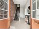 Modern entryway with brick accent wall, open staircase, and tile flooring at 1199 Huff Nw Rd # 109, Atlanta, GA 30318