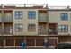 Exterior shot of the home featuring balconies, garage spaces, and neutral-colored siding at 1199 Huff Nw Rd # 109, Atlanta, GA 30318