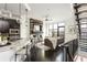 Open-concept living room with dark wood floors, modern fireplace, and spacious kitchen area at 1199 Huff Nw Rd # 109, Atlanta, GA 30318
