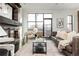 Comfortable living room with fireplace, large windows, stylish furnishings, and lots of natural light at 1199 Huff Nw Rd # 109, Atlanta, GA 30318