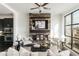 Bright living room with modern fireplace, kitchen view, and large windows at 1199 Huff Nw Rd # 109, Atlanta, GA 30318