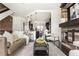 Open-concept living room, modern decor, fireplace, and barstool seating at the kitchen island at 1199 Huff Nw Rd # 109, Atlanta, GA 30318