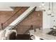 Cozy kitchen space with an exposed brick staircase and modern lighting at 1199 Huff Nw Rd # 109, Atlanta, GA 30318