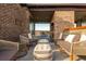 Charming outdoor seating area features brick accents, lighting, and comfortable lounge seating at 1199 Huff Nw Rd # 109, Atlanta, GA 30318