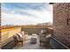Comfortable outdoor patio with stylish seating and a view of the beautiful city skyline at 1199 Huff Nw Rd # 109, Atlanta, GA 30318