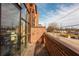 Brick patio with views of the city skyline and reflective glass at 1199 Huff Nw Rd # 109, Atlanta, GA 30318