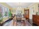 Spacious dining room with a chandelier and traditional furnishings at 1241 Briarcliff Rd, Atlanta, GA 30306