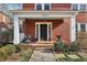 Inviting brick porch with white columns and a welcoming entrance at 1241 Briarcliff Rd, Atlanta, GA 30306