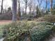A vibrant backyard is landscaped with lush greenery and flower beds, adding to the property's charm at 1376 Keys Lake Ne Dr, Brookhaven, GA 30319
