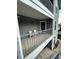Exterior balcony with two chairs and a neighborhood view at 1376 Keys Lake Ne Dr, Brookhaven, GA 30319