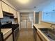 Efficient kitchen layout with a range, a washer/dryer and a dishwasher at 1376 Keys Lake Ne Dr, Brookhaven, GA 30319