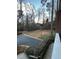 Well-maintained landscaped lawn with trees in the background at 1376 Keys Lake Ne Dr, Brookhaven, GA 30319