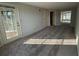 Bright and airy living room with glass door to the patio and wall-to-wall carpet at 1376 Keys Lake Ne Dr, Brookhaven, GA 30319
