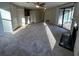 Living room has new carpet, fireplace, ceiling fan, and sliding glass door to balcony at 1376 Keys Lake Ne Dr, Brookhaven, GA 30319