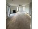 Living room with neutral carpet, ceiling fan, fireplace, and natural light at 1376 Keys Lake Ne Dr, Brookhaven, GA 30319