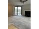 The living room has a ceiling fan, fireplace and sliding glass door with a balcony at 1376 Keys Lake Ne Dr, Brookhaven, GA 30319