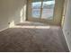 Carpeted living room with good light from two windows at 1376 Keys Lake Ne Dr, Brookhaven, GA 30319