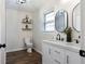 Stylish bathroom featuring a double vanity with modern fixtures and floating shelves at 62 E Georgia Ave, Emerson, GA 30137