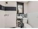 A bathroom showcasing tiling detail, sink, toilet, and shower features at 8640 Embrey Dr, Jonesboro, GA 30236