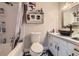 Bathroom featuring a black vessel sink, white cabinets, and tub with shower at 8640 Embrey Dr, Jonesboro, GA 30236