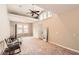 Spacious bonus room features vaulted ceilings, a ceiling fan, and natural light at 8640 Embrey Dr, Jonesboro, GA 30236