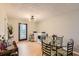 Dining area featuring a glass table, washer, dryer, and backyard views at 8640 Embrey Dr, Jonesboro, GA 30236