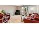 Open living room showcasing a large window, wood floors, and comfortable seating at 8640 Embrey Dr, Jonesboro, GA 30236