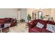 Open living room with lots of seating, wood floors, and plenty of natural light at 8640 Embrey Dr, Jonesboro, GA 30236