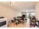 Open floorplan with dining area, washer, dryer, and cozy living room at 8640 Embrey Dr, Jonesboro, GA 30236