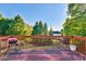 View from deck overlooking landscaped backyard with lush trees at 2837 Captain Ct, Dacula, GA 30019