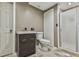 A simple bathroom with a shower, vanity, and toilet features neutral paint and tiled floors at 2837 Captain Ct, Dacula, GA 30019