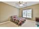 Comfortable bedroom with ceiling fan, natural light, and warm carpet, creating a welcoming space at 2837 Captain Ct, Dacula, GA 30019