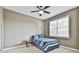 Inviting bedroom featuring a soft carpet, ceiling fan and a sunlit window with peaceful ambiance at 2837 Captain Ct, Dacula, GA 30019