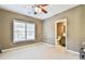 Spacious bedroom with a window view to the backyard with attached bathroom at 2837 Captain Ct, Dacula, GA 30019