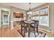 Bright breakfast nook with natural light, built-in cabinets, and hardwood flooring at 2837 Captain Ct, Dacula, GA 30019