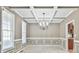 Elegant dining room featuring decorative molding, modern chandelier, and natural lighting at 2837 Captain Ct, Dacula, GA 30019