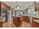 Kitchen with stainless appliances, kitchen island, and hardwood floors at 2837 Captain Ct, Dacula, GA 30019