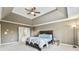 Large Primary bedroom with tray ceiling, ceiling fan, and ensuite bath at 2837 Captain Ct, Dacula, GA 30019