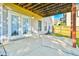 Concrete patio area with french doors and a view of the backyard and partially covered by the deck above at 2837 Captain Ct, Dacula, GA 30019